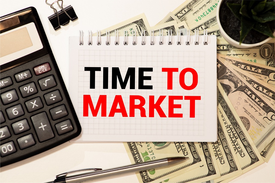 Notepad with text Time To Invest on Market charts and pen time to market, design for manufacturing, investment, new product, product launch